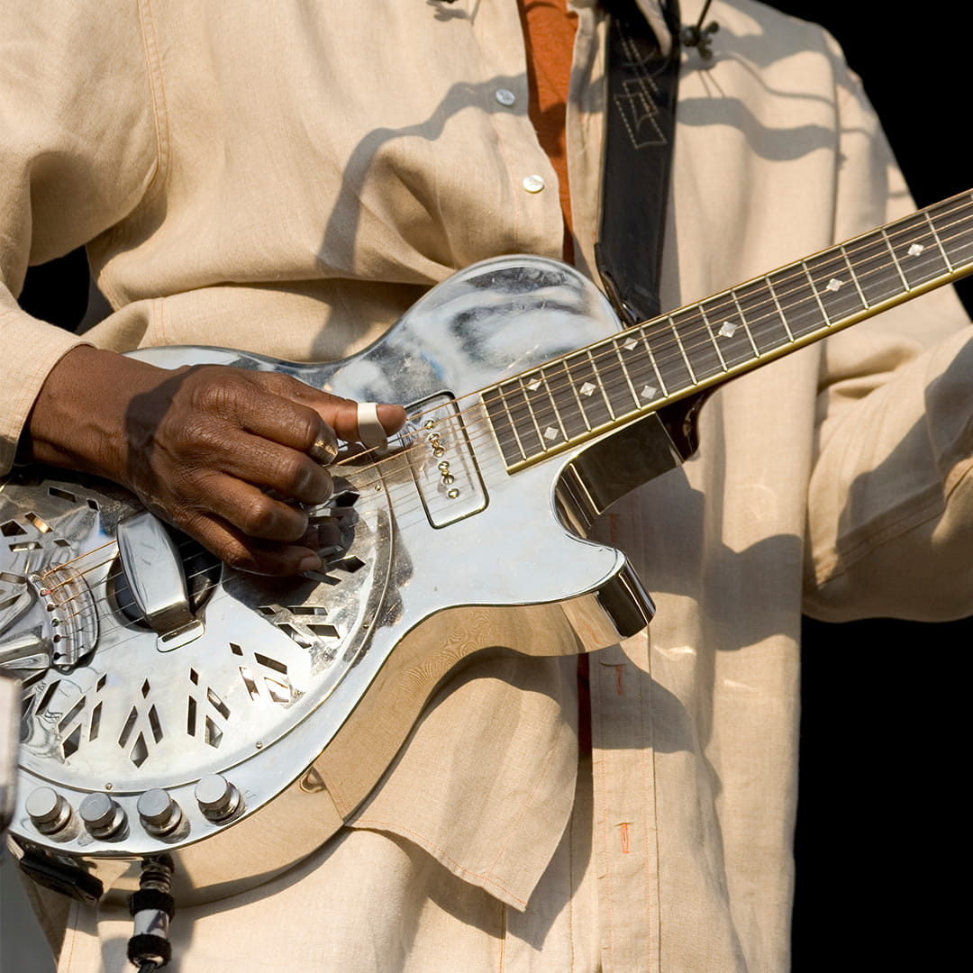 Male playing a guitar